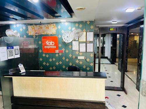 a restaurant counter with ahi orders sign on a wall at Hotel Lotus Villa - Near Nehru Enclave Metro Station in New Delhi