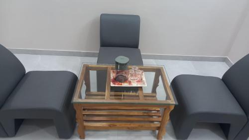 Posezení v ubytování Maruthamalai Andavar Residency
