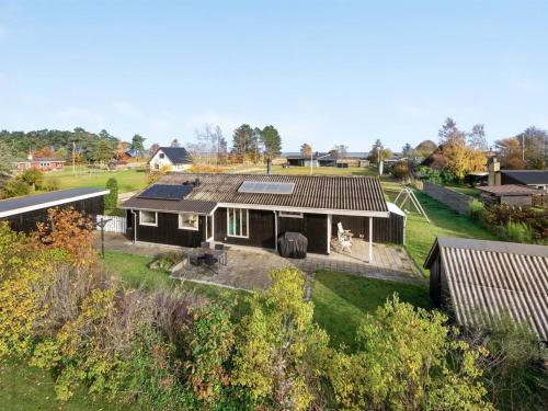 an aerial view of a house with solar panels on it at Holiday Home Joon - 300m from the sea by Interhome in Ørsted