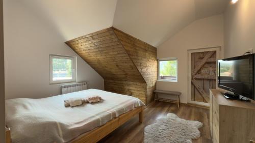 Ένα ή περισσότερα κρεβάτια σε δωμάτιο στο Rustic House Busteni