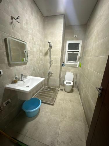 a bathroom with a sink and a toilet at Luxury Duplex Villa in Mazarine, New Alamein in El Alamein