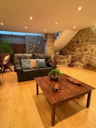 a living room with a couch and a coffee table at Corte Grande in Zebras