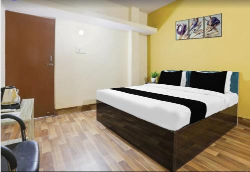a bedroom with a large bed in a room at The Vinayaka Guest House in Dānāpur