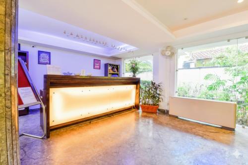 a large room with a large screen in the middle at FabHotel Prime The King's Court - Nr Calangute Beach in Calangute