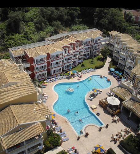 an aerial view of a resort with a swimming pool at Paradise Hotel Apartments Sidari in Sidari