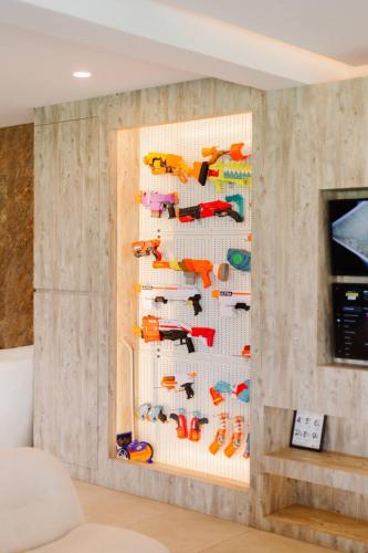 a wall with a display of colorful fish at Palm Villa - Award Winning Modern Luxury & Exclusive Villa in Chiang Mai