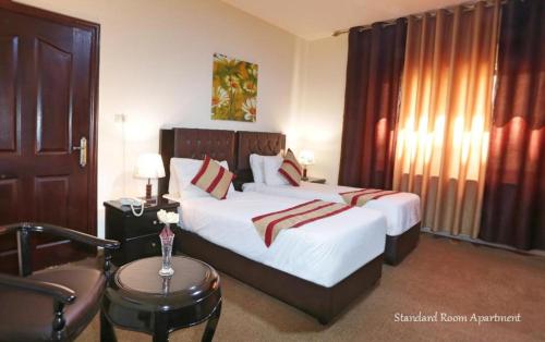 Katil atau katil-katil dalam bilik di BT Hotel Aparatment