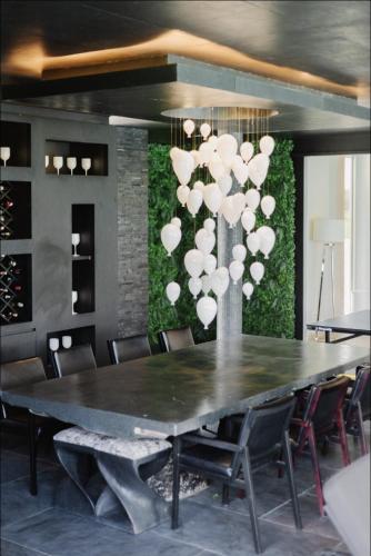 a dining room with a large table with chairs at Palm Villa - Award Winning Modern Luxury & Exclusive Villa in Chiang Mai
