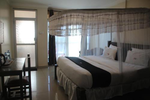 Postel nebo postele na pokoji v ubytování Kadz Hotel