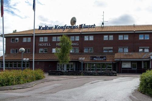 a large red brick building with a hotel at Monicas B&B in Hagfors