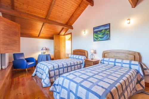 Ένα ή περισσότερα κρεβάτια σε δωμάτιο στο Casa da Roteia