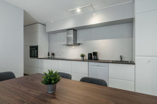 Η κουζίνα ή μικρή κουζίνα στο MAYA Apartments - Sentrum
