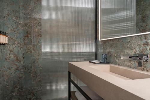 a bathroom with a sink and a shower at Casa Guttmann in Rome