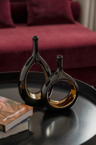 two pairs of scissors sitting on a table at Casa Guttmann in Rome