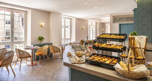 a hotel lobby with a display of fruit at Best Western Poitiers Centre Le Grand Hôtel in Poitiers