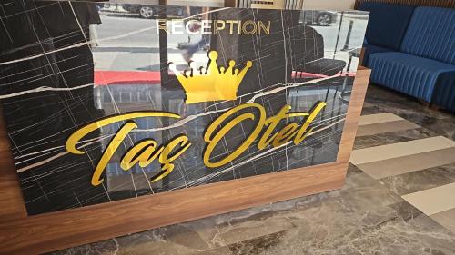 a sign for a ice office with a crown on it at Taç hotel in Istanbul