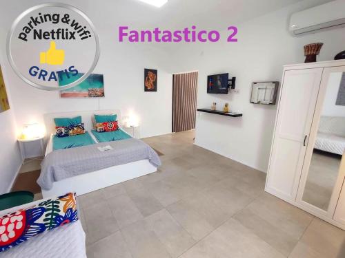 Ένα ή περισσότερα κρεβάτια σε δωμάτιο στο Fantastico Apartments Terrasse Balkon Klima Küche Gratis Parkplatz BBQ Puerto de la Cruz
