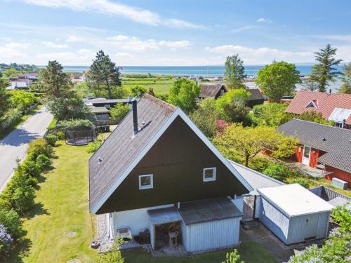 an aerial view of a house with a barn at Holiday Home Eikka - 100m from the sea by Interhome in Knebel