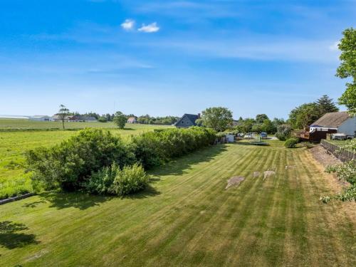 an aerial view of a field with trees and a house at Apartment Veronica - 700m from the sea by Interhome in Sæby