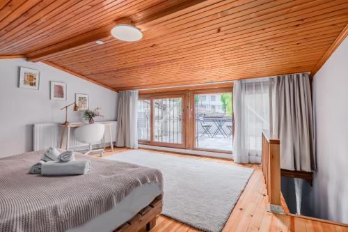 a bedroom with a bed and a large window at Detached Triplex with Garden Terrace in Istanbul