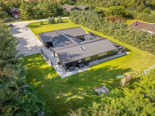 an overhead view of a large house with a yard at Holiday Home Ema - 1-9km from the sea by Interhome in Saltum