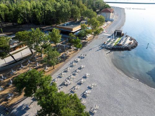 an aerial view of a beach with a bunch of parked cars at Sailors Village - Marina Monfalcone 
