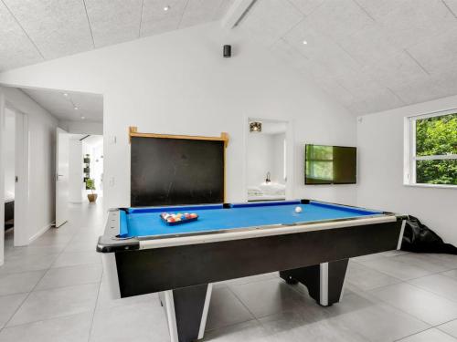 a large room with a pool table in it at Holiday Home Patrice - 300m from the sea by Interhome in Strøby