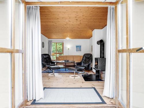 an open living room with a table and chairs at Holiday Home Ahnandia - 200m from the sea by Interhome in Jerup