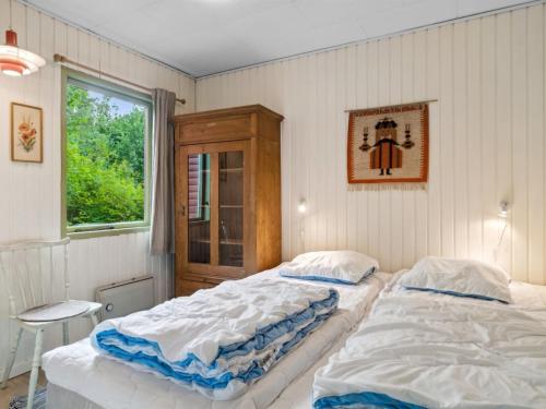 Ένα ή περισσότερα κρεβάτια σε δωμάτιο στο Holiday Home Lovisa - 7km from the sea by Interhome