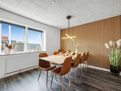 a dining room with a table and chairs at Holiday Home Darja - 300m from the sea by Interhome in Thyborøn