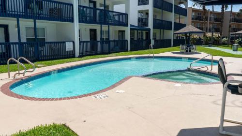 a large swimming pool in front of a building at Surfside II #109 home in Coffeyville