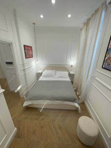 a bedroom with a large bed in a room at Fronte Reggia Apartment in Caserta