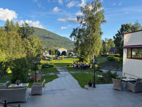 a view of a patio with tables and chairs at Eikum Hotel in Hafslo