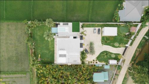 an overhead view of a house with a yard at Palm Villa - Award Winning Modern Luxury & Exclusive Villa in Chiang Mai