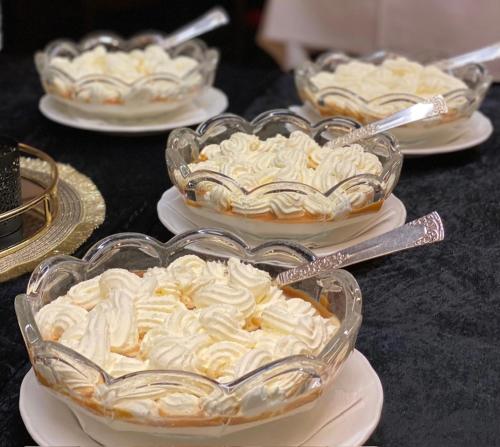 a group of desserts in glass bowls on plates at Eikum Hotel in Hafslo