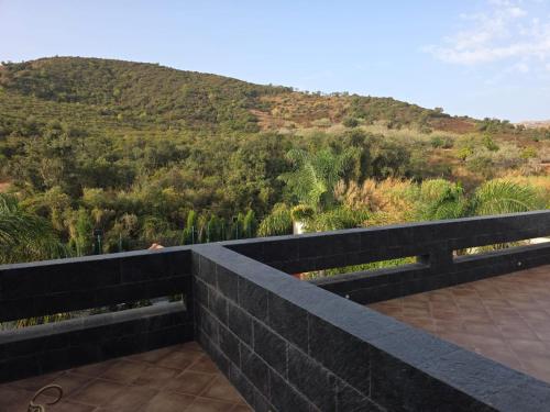 a balcony with a view of a mountain at Villa privé Tetouan avec piscine in Tetouan