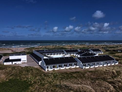 an overhead view of a building with the ocean in the background at Apartment Edisa - 50m from the sea by Interhome in Brovst
