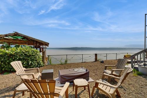 a group of chairs and a table with a laptop at Hood Canal House in Shelton