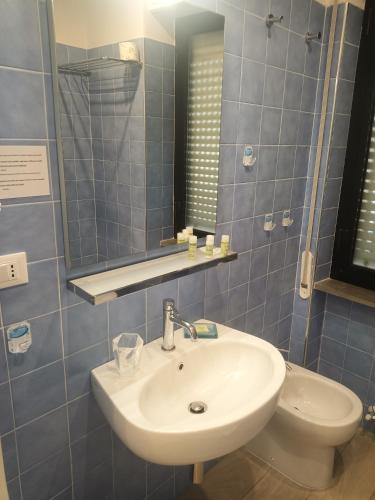 a bathroom with a sink and a toilet at Residence Le Dune Club in Varigotti