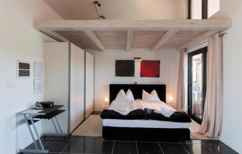 a bedroom with a bed with pillows on it at Villa Pucalo by Villas Guide in Kampor