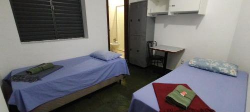 Katil atau katil-katil dalam bilik di Hotel Chalé Centro