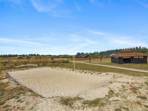 a sand trap in the middle of a field at Holiday Home Dorithea - 3-5km from the sea by Interhome in Brovst