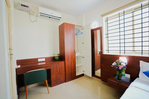 Ένα ή περισσότερα κρεβάτια σε δωμάτιο στο Mystic Aero Hotel Near Bangalore International Airport