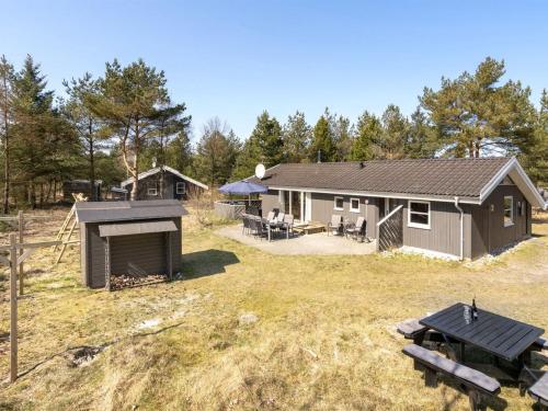 an aerial view of a house with a backyard at Holiday Home Sighbiorn - 950m from the sea by Interhome in Fjerritslev
