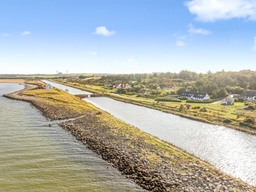 an aerial view of a river with houses in the distance at Holiday Home Agrippa - 30m to the fjord by Interhome in Løgstør