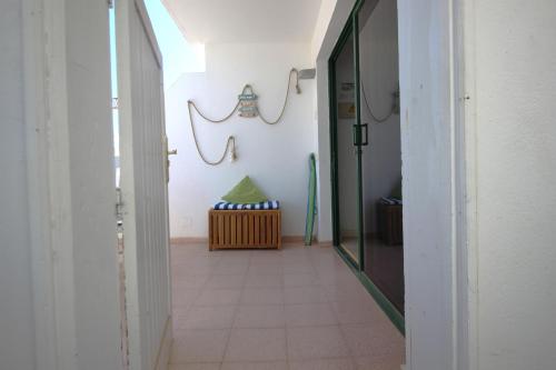 a hallway with a door to a room at OceanEye Apartment with heated pool in Mogán