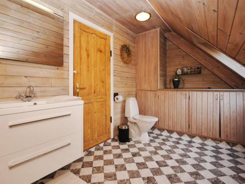 a bathroom with a toilet and a sink at Holiday Home Millie - 3km to the fjord by Interhome in Løgstør