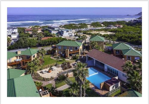 an aerial view of a house and the ocean at Nora's Place in Sedgefield
