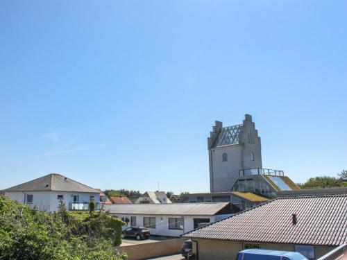 a tall building in the distance with roofs at Holiday Home Brun - 60m from the sea by Interhome in Læsø