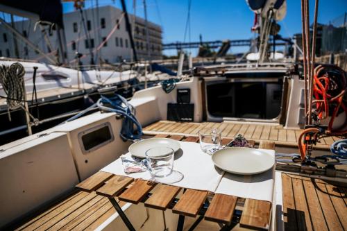 a table on a boat with glasses on it at The Classic Sailboat Retreat in Lisbon
